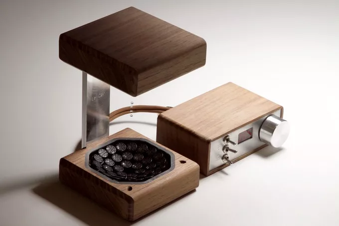 The device is crafted in stylish walnut wood casings