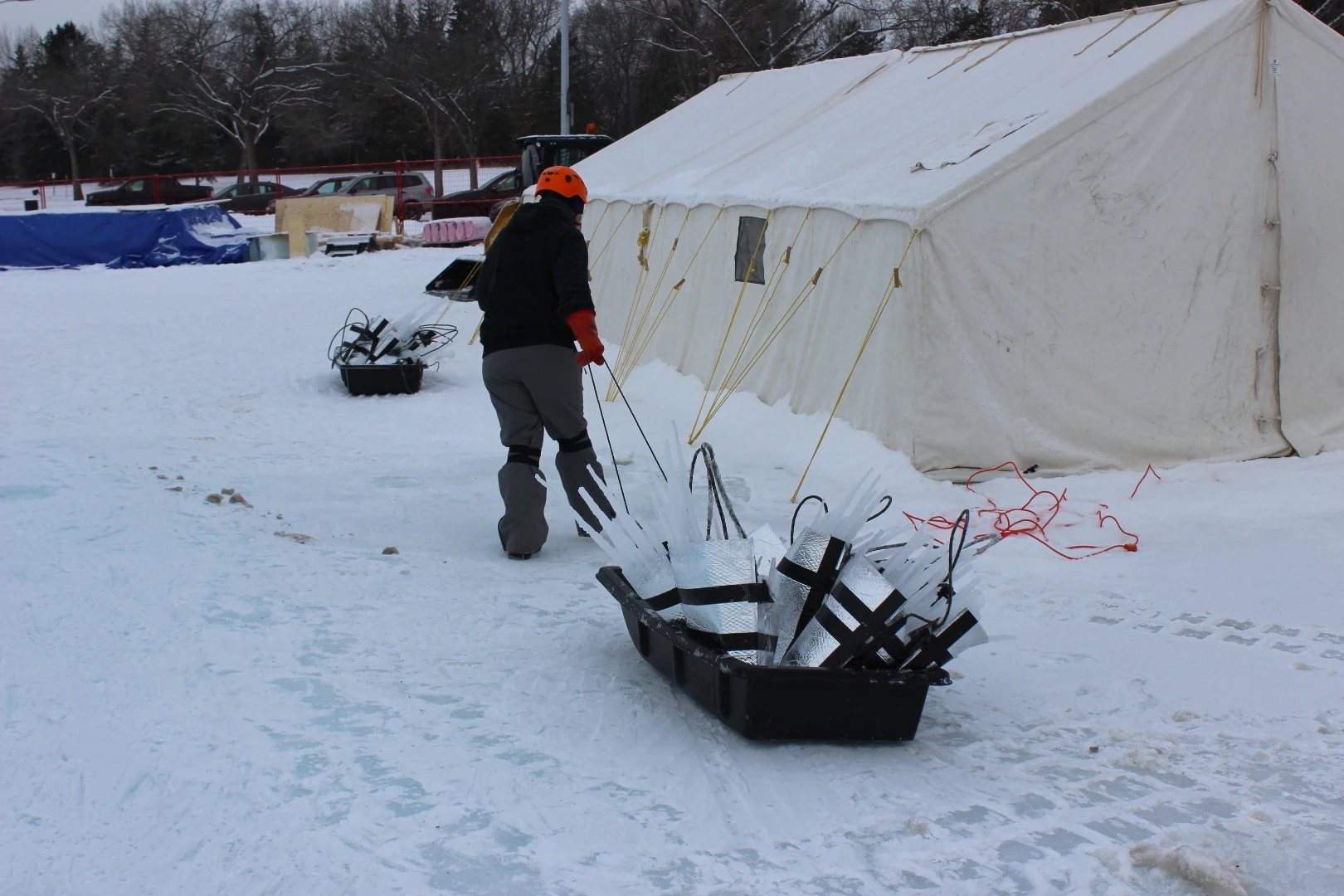 A sled-load of the icicles are hauled away