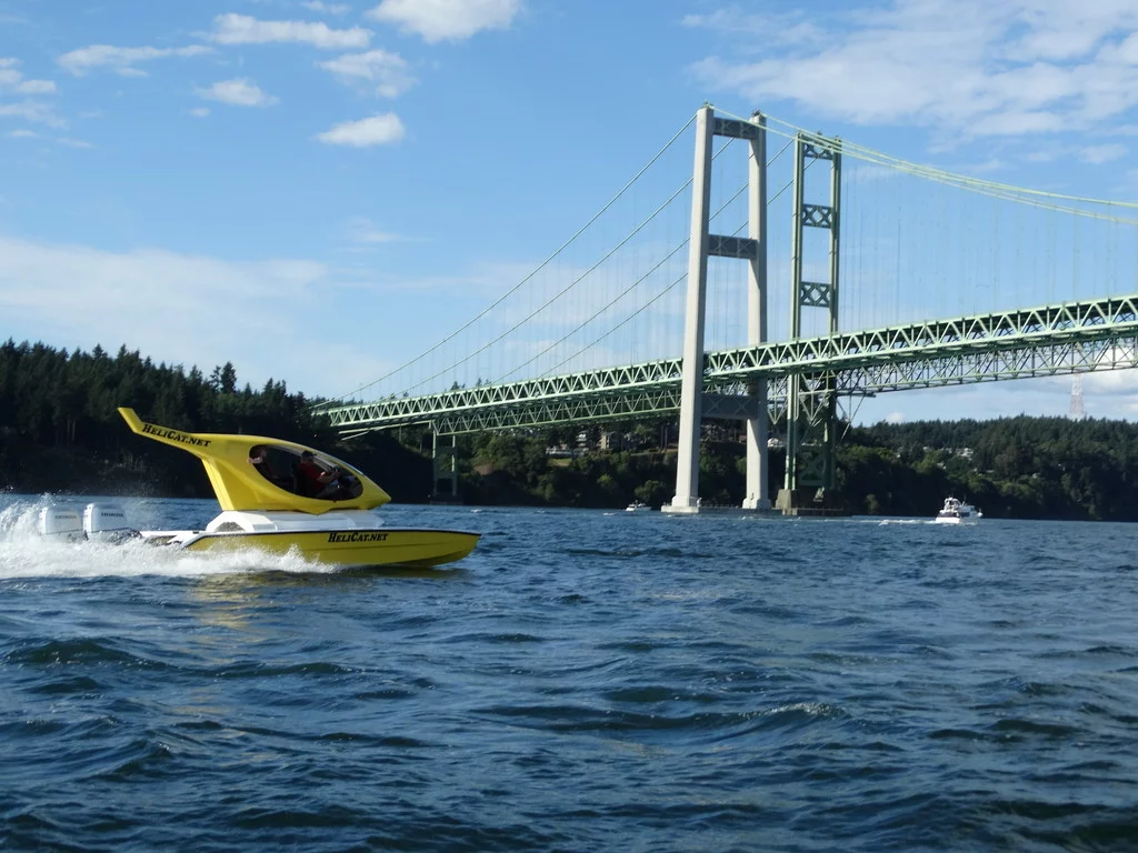 Helicat navigates the waters below Tacoma Narrows Bridge
