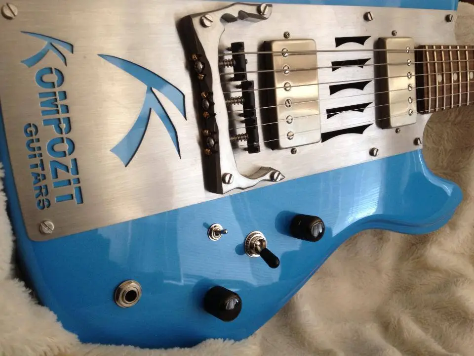 Close up of The Two's proprietary custom bridge, a 3-way pickup selector, a pickup split switch, and volume and tone knobs
