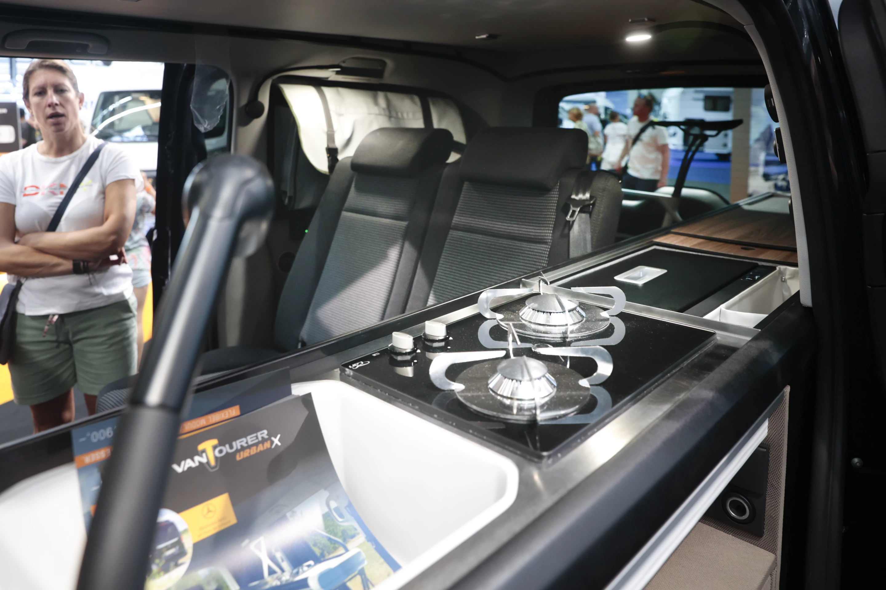 The long Urban X kitchen includes a sink, dual-burner stove and fridge box