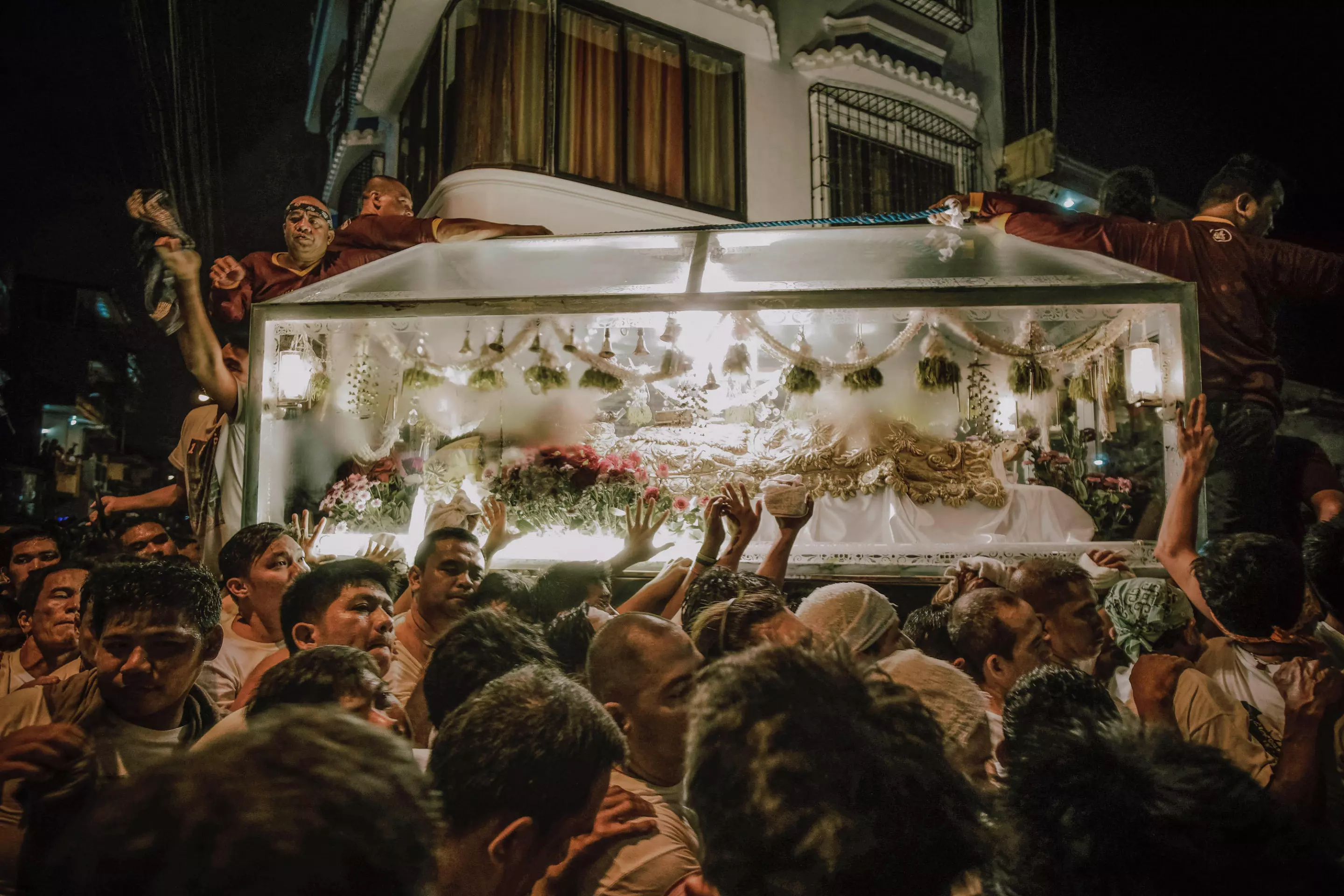 Winner in ‘The Photojournalist’ category. This incredible series documents an annual religious ritual in Lucban, Quezon Philippines. A procession moves a glass coffin carrying an image of Jesus Christ through the town. Participants believe the tradition will bring luck and success.