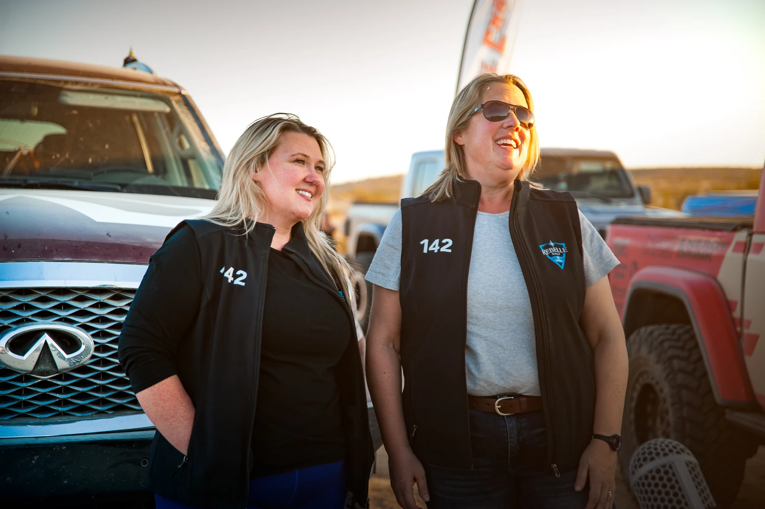 The Rebelle Rally 2020 Navigator Alice Chase (left) and driver Nicole Wakelin (right) pose in front of the 2021 QX80 they drove for the competition