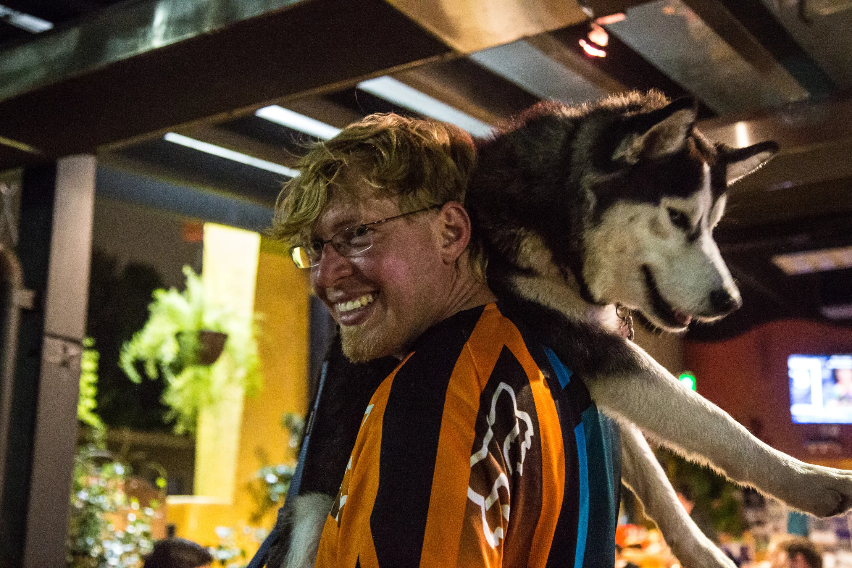 Charger rides Terry's shoulders as much as she rides his bike