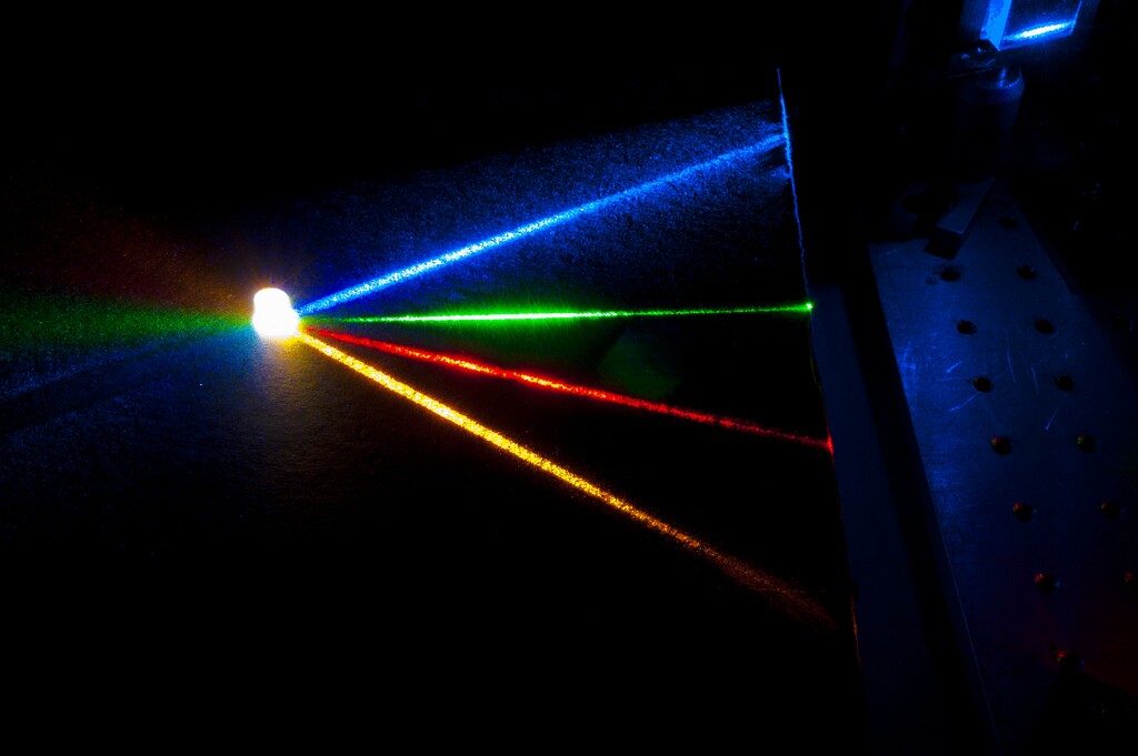 Four laser beams -- yellow, blue, green and red -- converge to produce a warm white light (Photo: Randy Montoya)