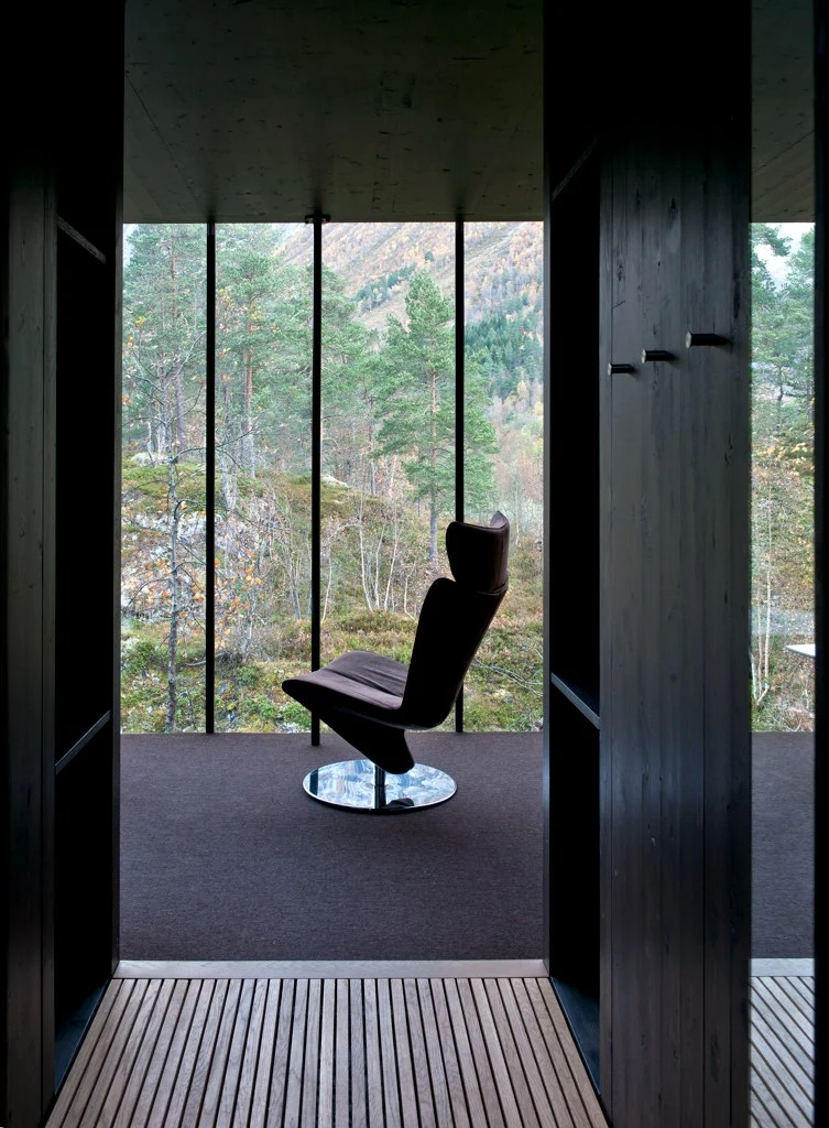 The interior is kept quite simple, with a few pieces of designer furniture