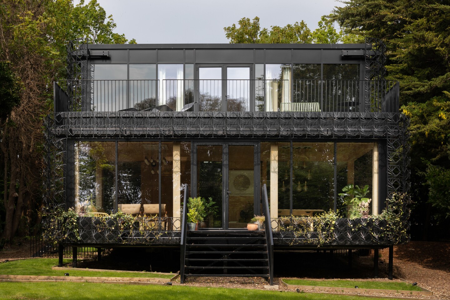 Plastic fantastic: Woven's exterior doesn't look all that lush at the moment but its intricate trellis-like plastic screen will become increasingly covered with greenery over time