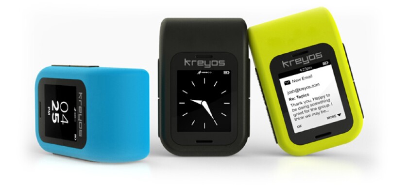 Some of the different watch face designs offered on the Kreyos Meteor, shown here attached to the belt clip
