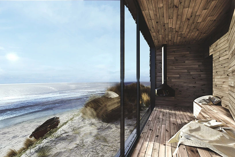 A dedicated place to relax by the fireplace was designed as a wooden and glassed terrace facing the sea, offering optimal views across the seaside
