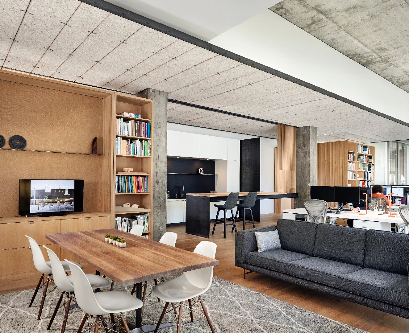 Alterstudio Architecture sought to soften the concrete interior with a European-cut white oak floor and rift-sawn white oak cabinets and screens