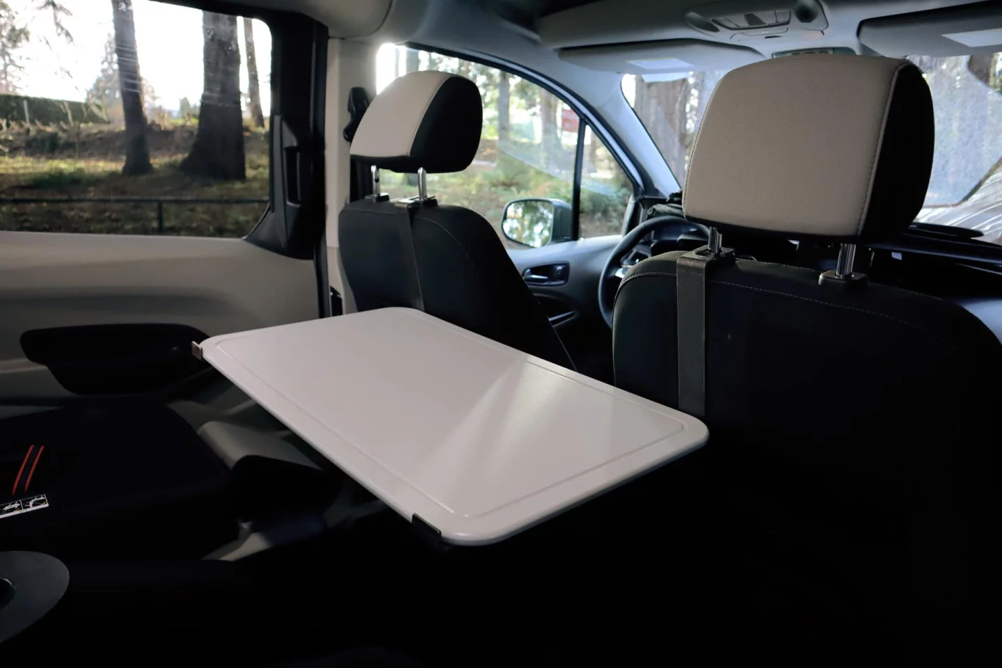 The cutting board doubles as a multi-position table