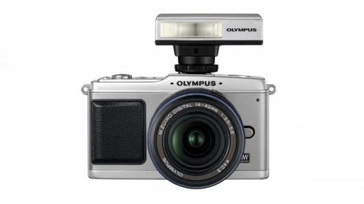The Olympus E-P1 shown with FL-14 flash unit installed