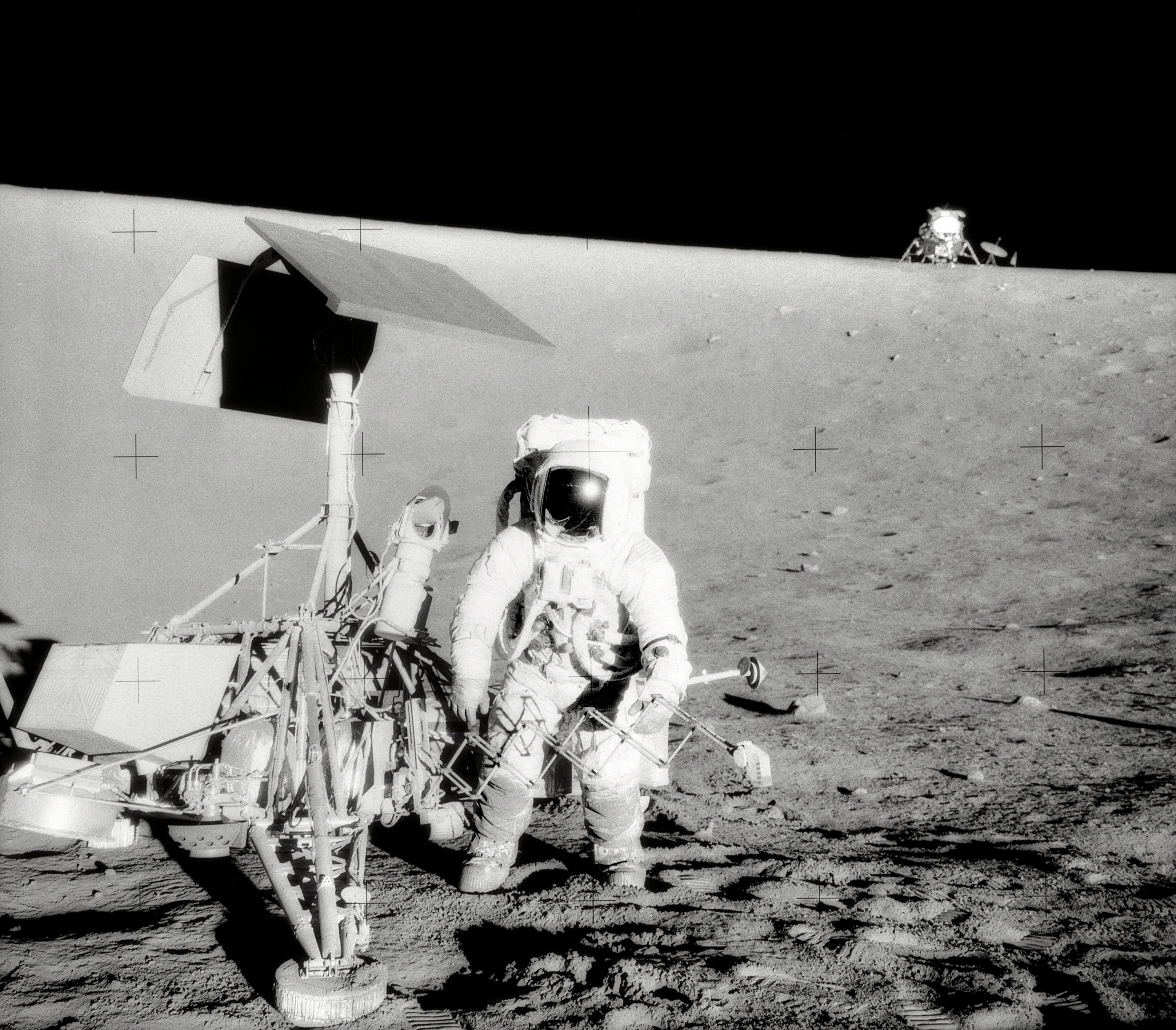 Mission Commander Conrad Bean examines the Surveyor 3 lander during the Apollo 12 mission (Image: NASA)