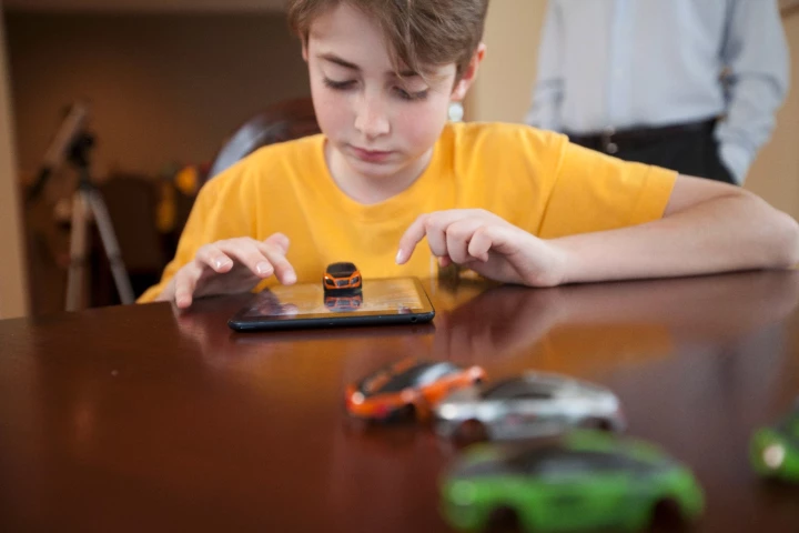 The Pocket Racing car will jump and jiggle depending on what happens on screen