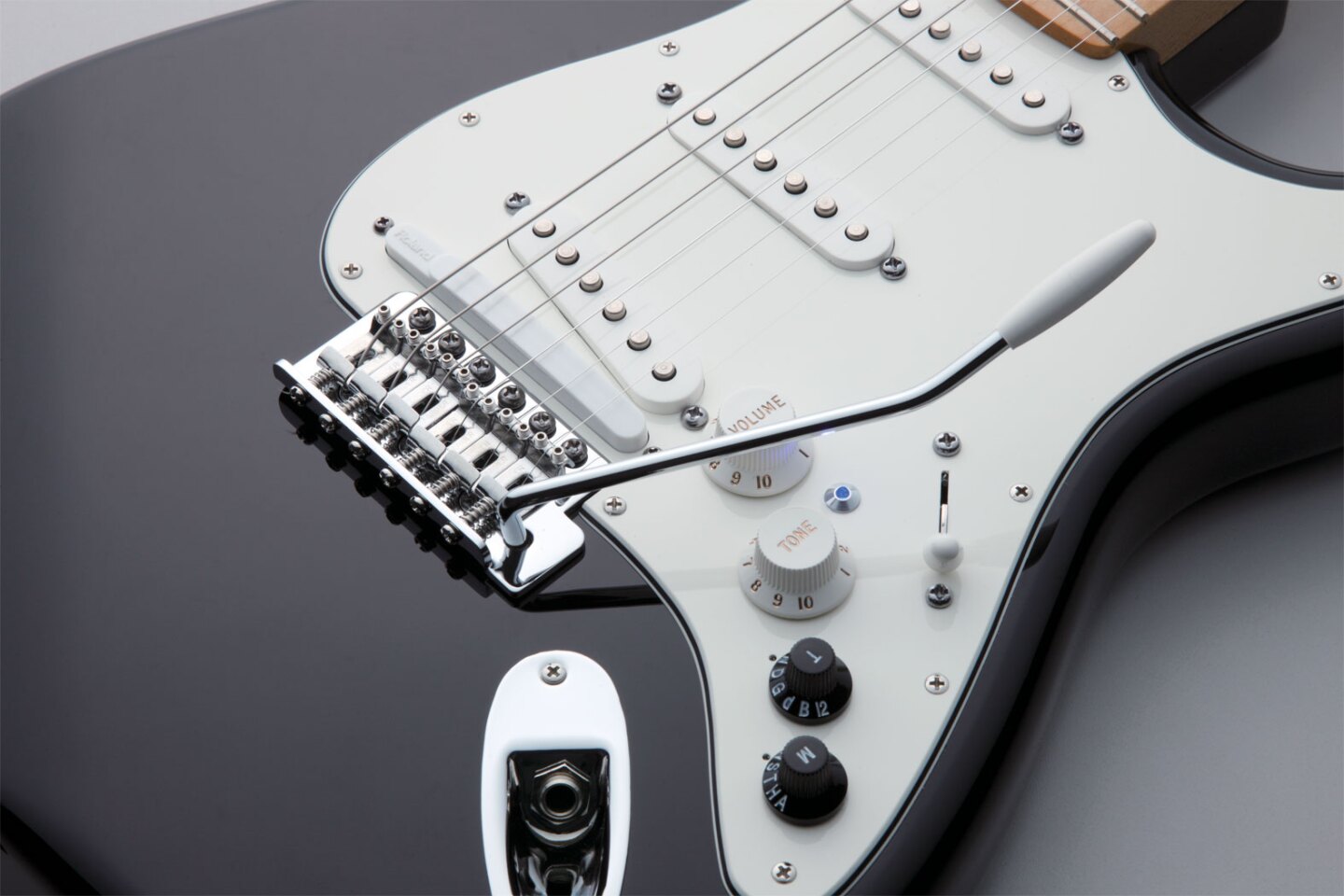 For all the digital sound manipulation magic to happen, there's a Roland GK-3 Divided Pickup mounted between the bridge and a "normal" pickup which sends the captured signal from each string to the COSM engine for digital processing