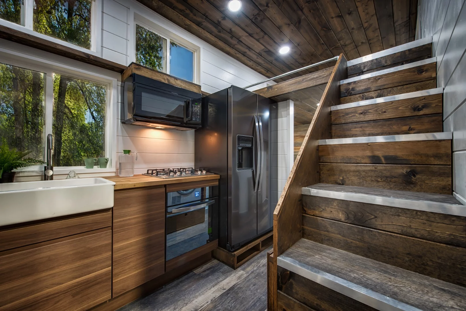 The Grizzly's kitchen includes a full-size fridge/freezer, propane-powered four-burner cooktop, oven, and microwave