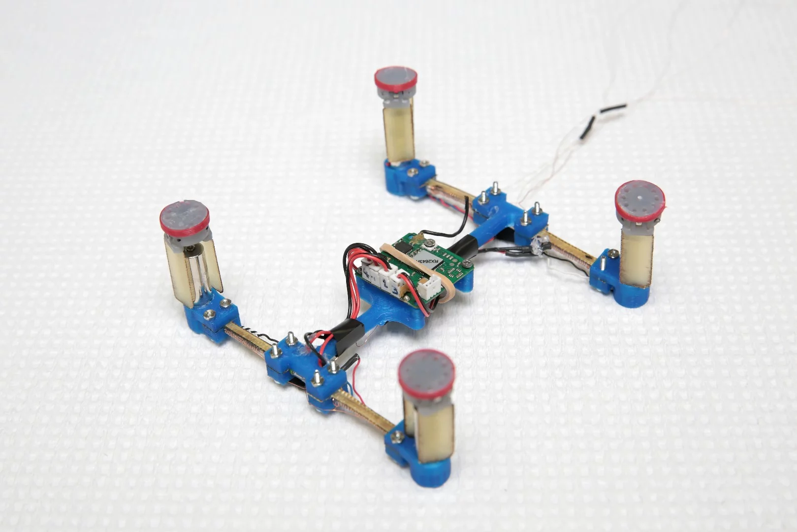 The team is currently putting the fiber to work in a drone that uses the varying stiffness to morph from miniature aircraft into a robotic car