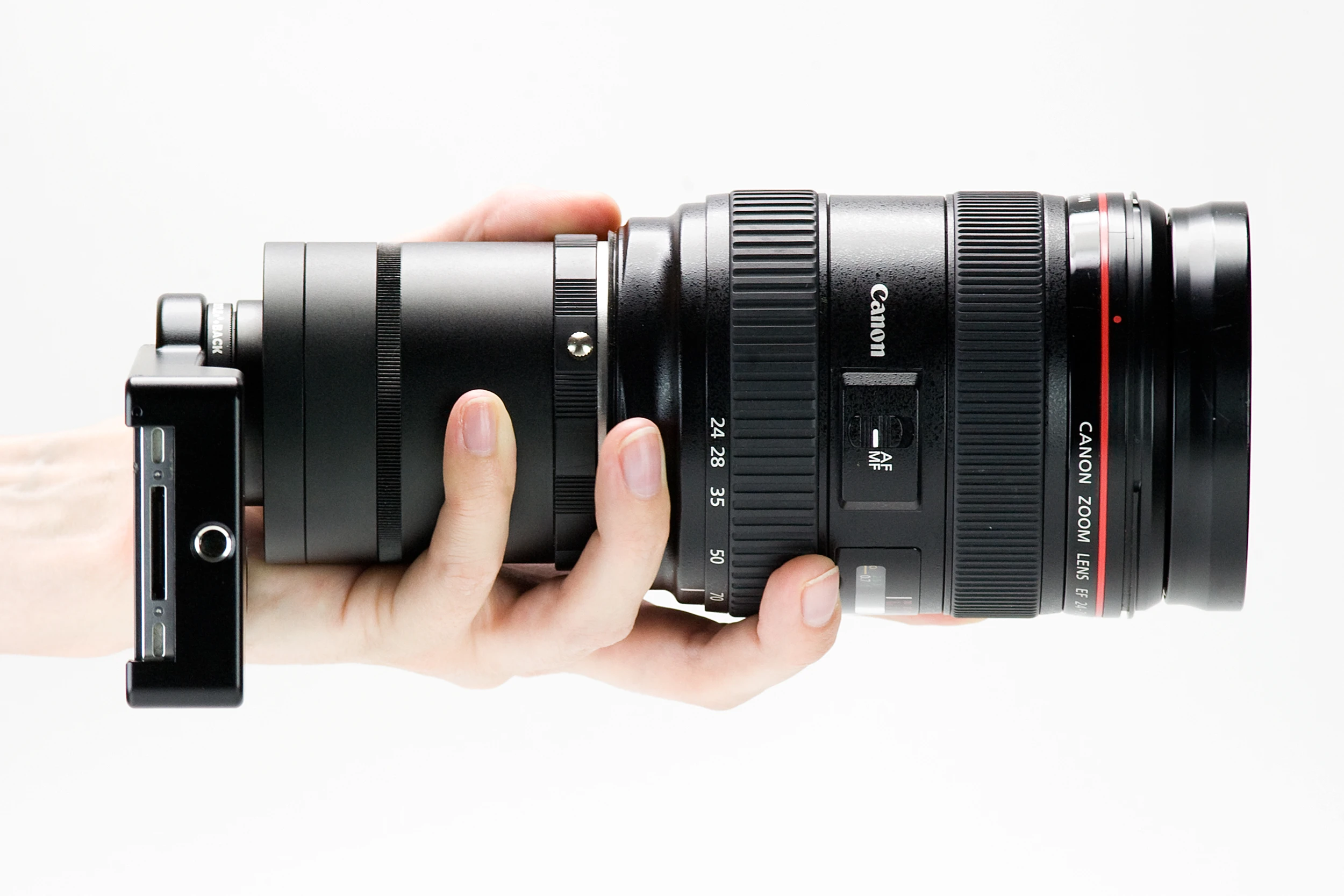 The iPhone SLR Mount from Photojojo is essentially a phone case that acts as either a Nikon F-mount lens adaptor or a Canon EF-mount lens adapter (Photo: Photojojo)