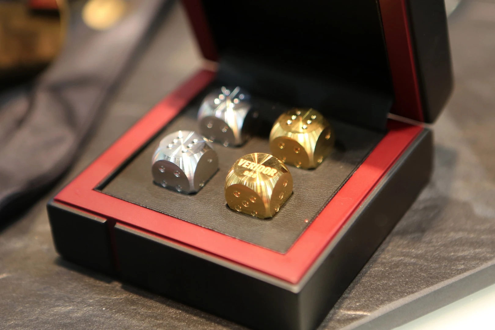 Dice in silver and gold from Veridor.