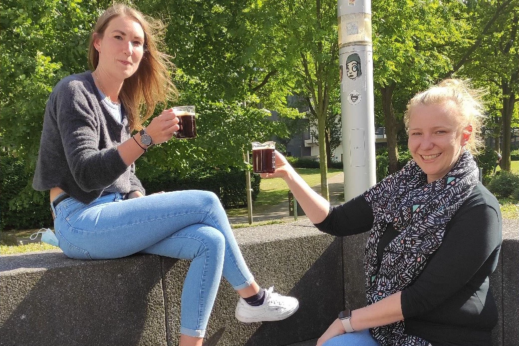 Laser coffee developer Dr. Anna Rosa Ziefuss (right) and colleage Tina Friedenhaur enjoy a beaker each of laser-extracted cold-brew coffee