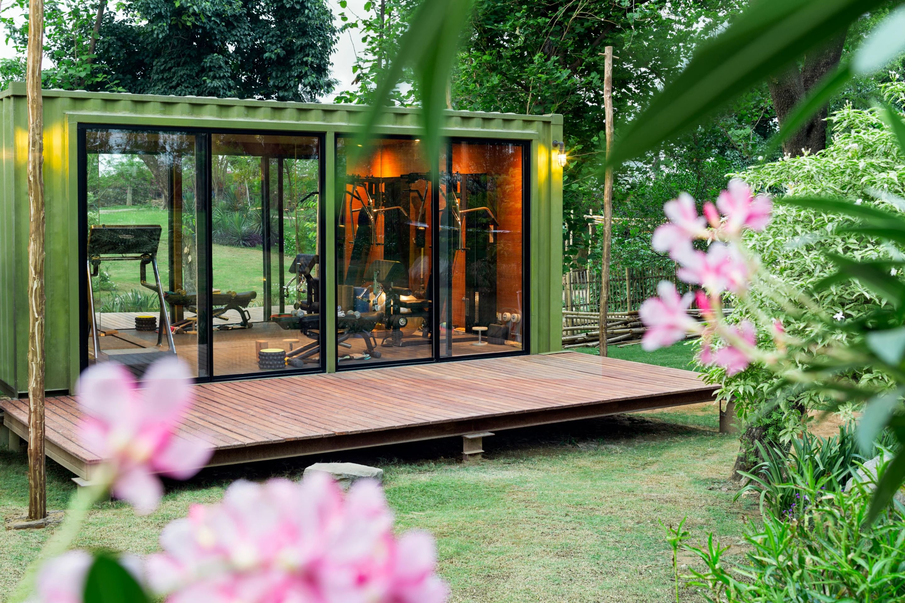 The two shipping container homes are raised above the ground to protect against flooding