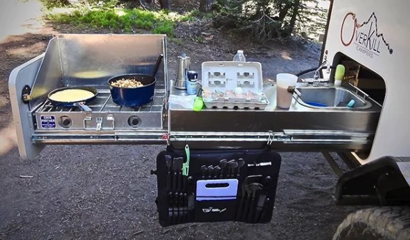 The slide-out itself and kitchen sink with folding faucet are part of the standard package