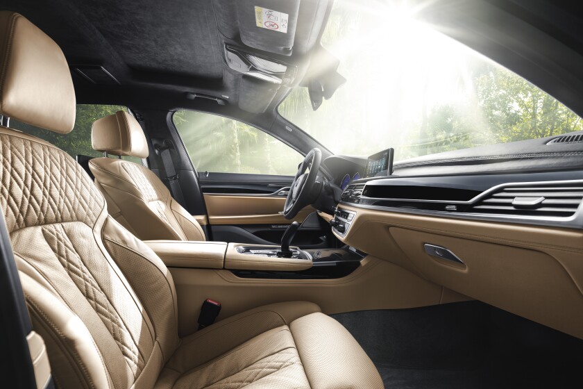 Inside, it's all about soft leather and piano black trim