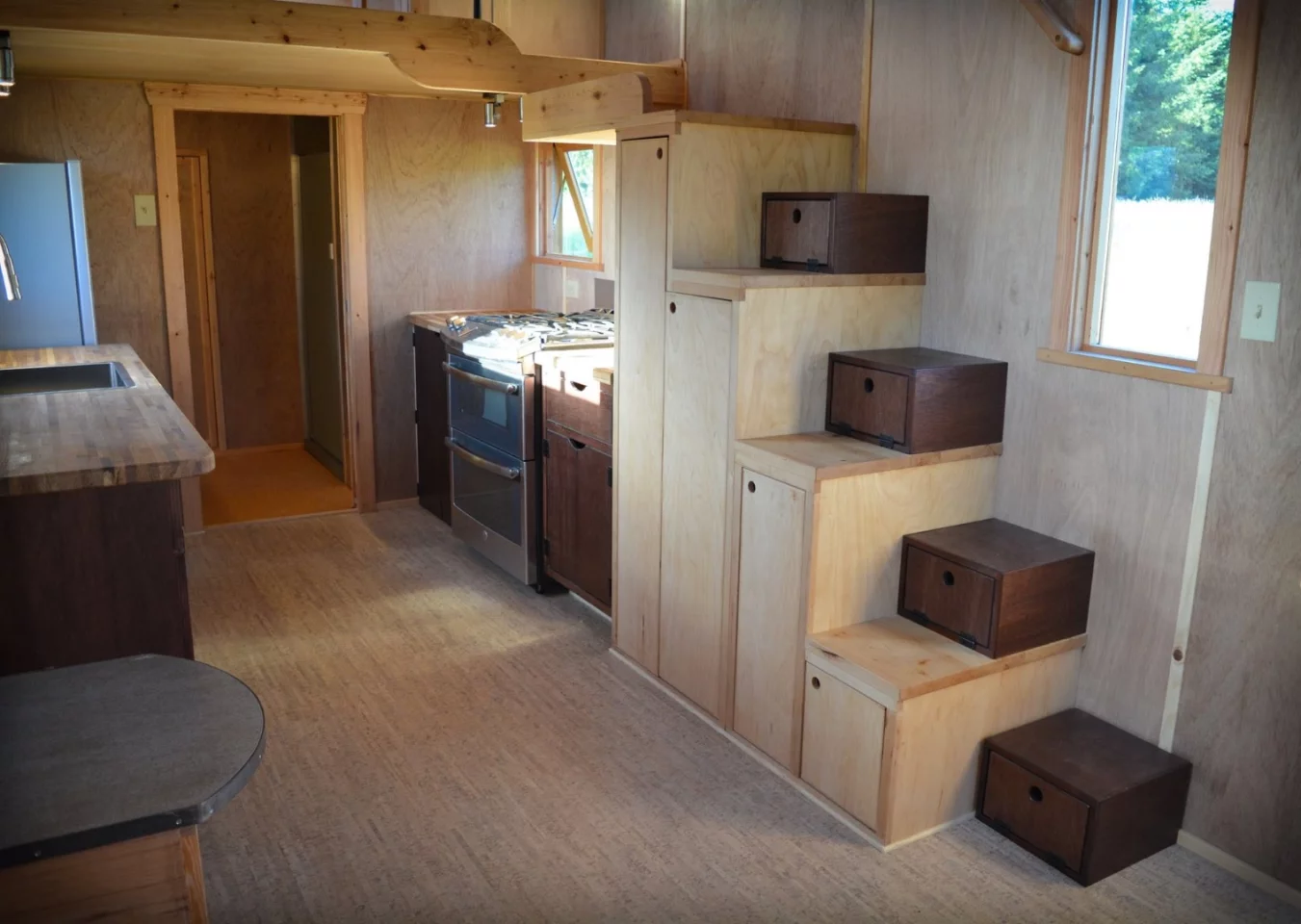 Storage-integrated stairs lead to the bedroom