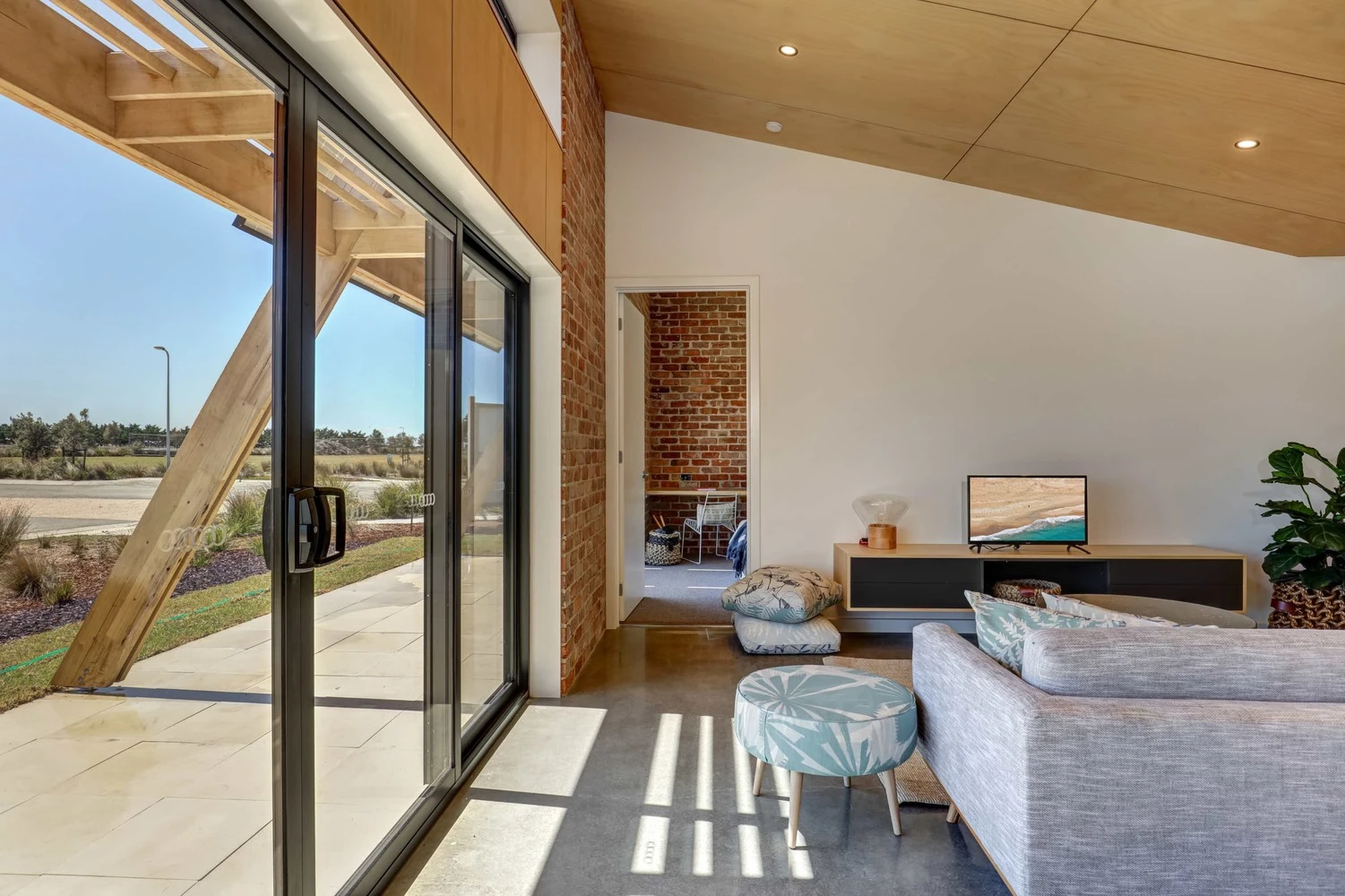 Large glass doors open the home up to the outdoors