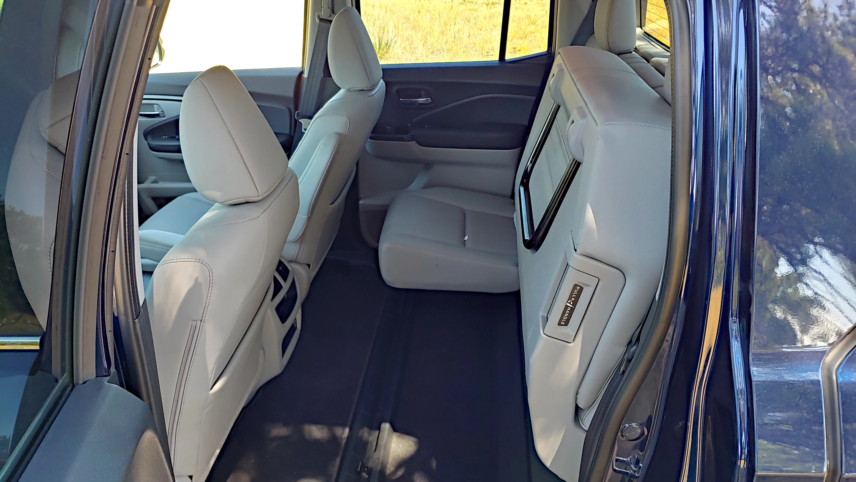 The rear seats in the 2020 Honda Ridgeline fold up to create a large load floor for added utility