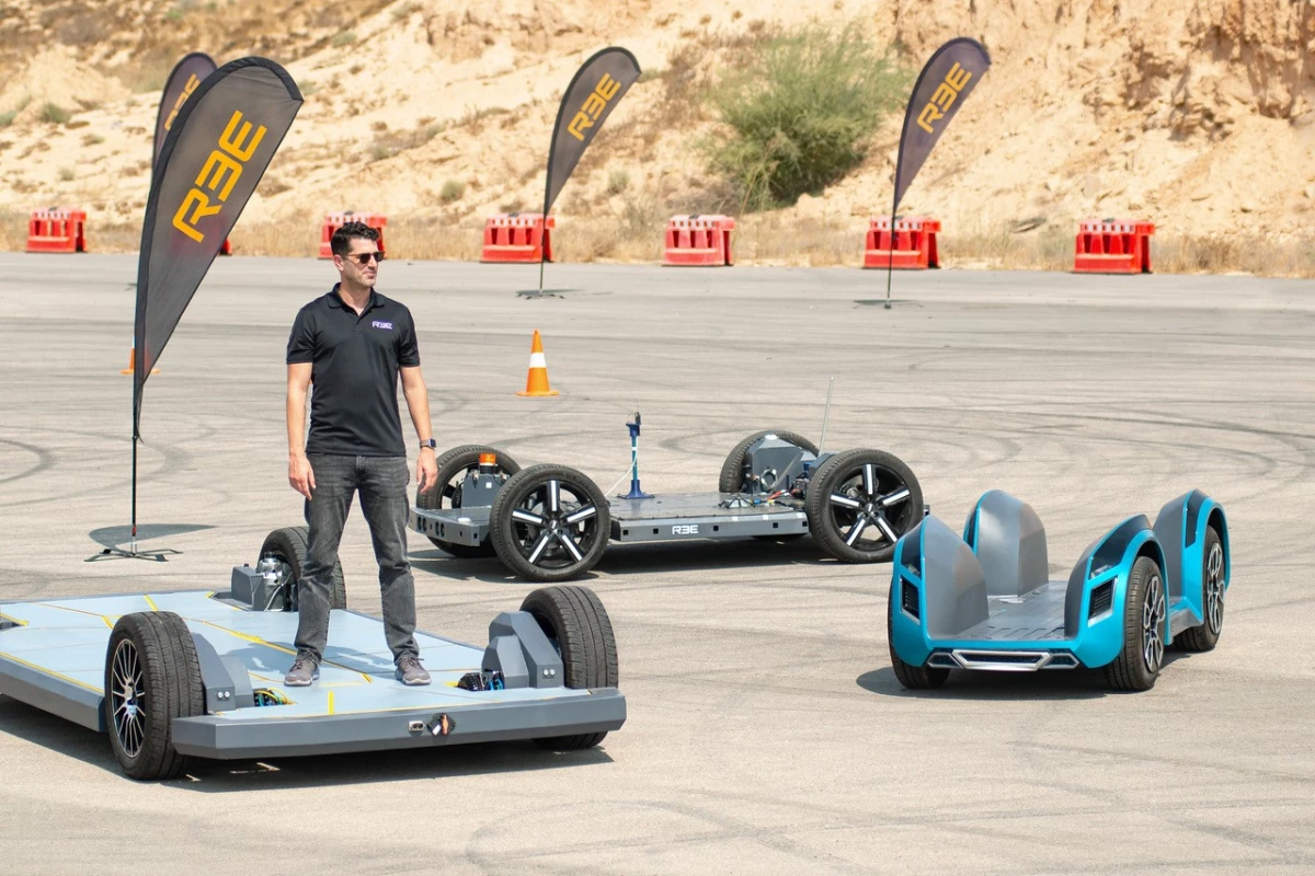 REE CEO and co-founder Daniel Barel rides the biggest skateboard (EV chassis) in town