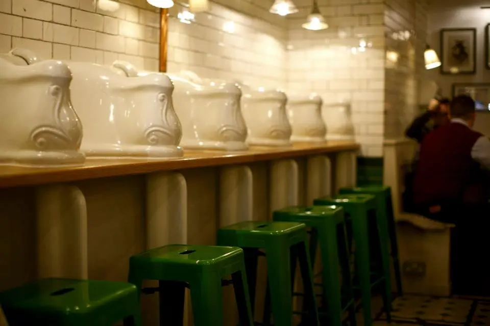 The urinals have been polished up and converted into bench style seating