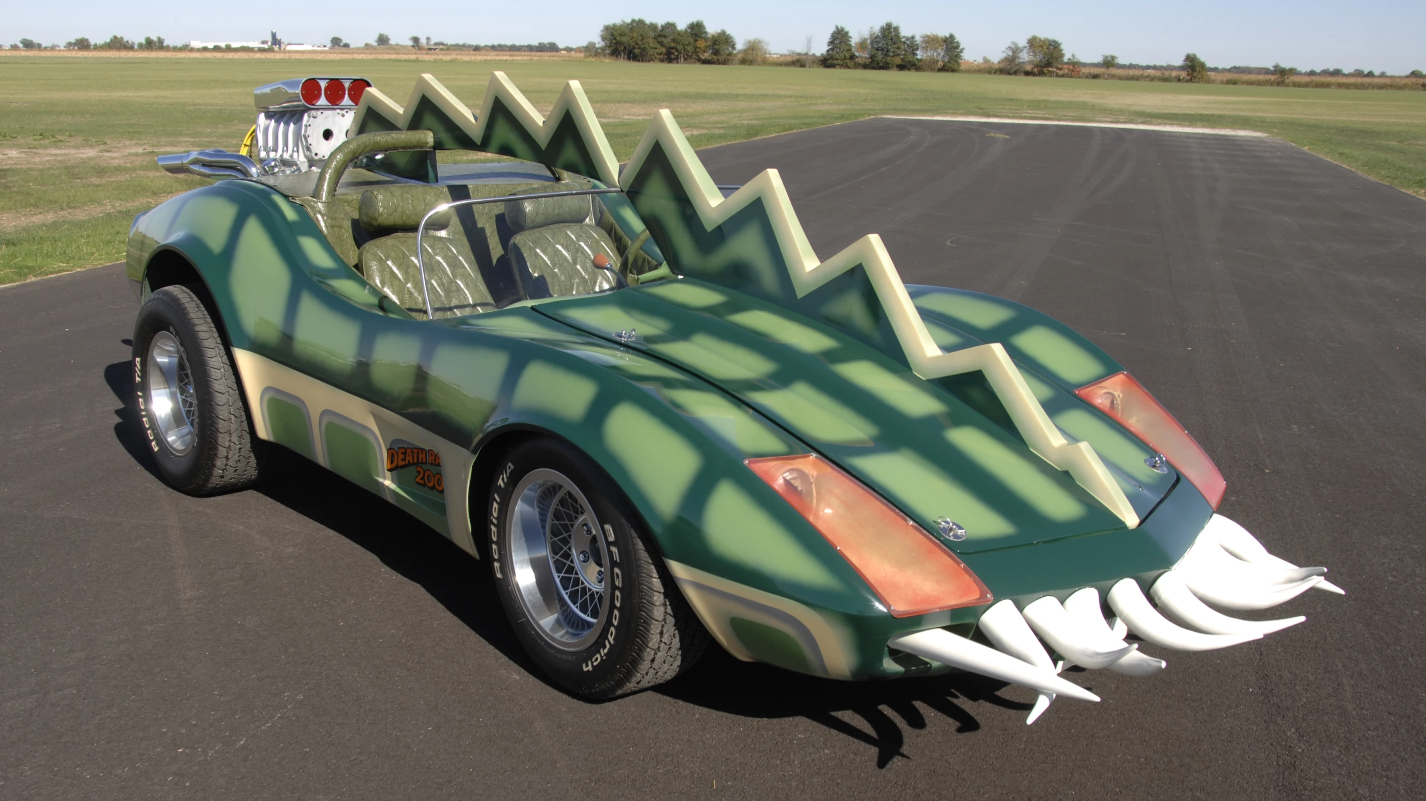 The car that is coming to auction is the Alligator Corvette driven by Carradine in Death Race 2000 (1975). The one-of-a-kind “alligator” Corvette (it's actually a Volkswagen chassis with an air-cooled Corvair motor), is expected to fetch between $20,000 and $25,000, despite the fact it got lots of screen time as Carradine (Frankenstein) fights against his deadly rival Stallone (Machine Gun Joe).
