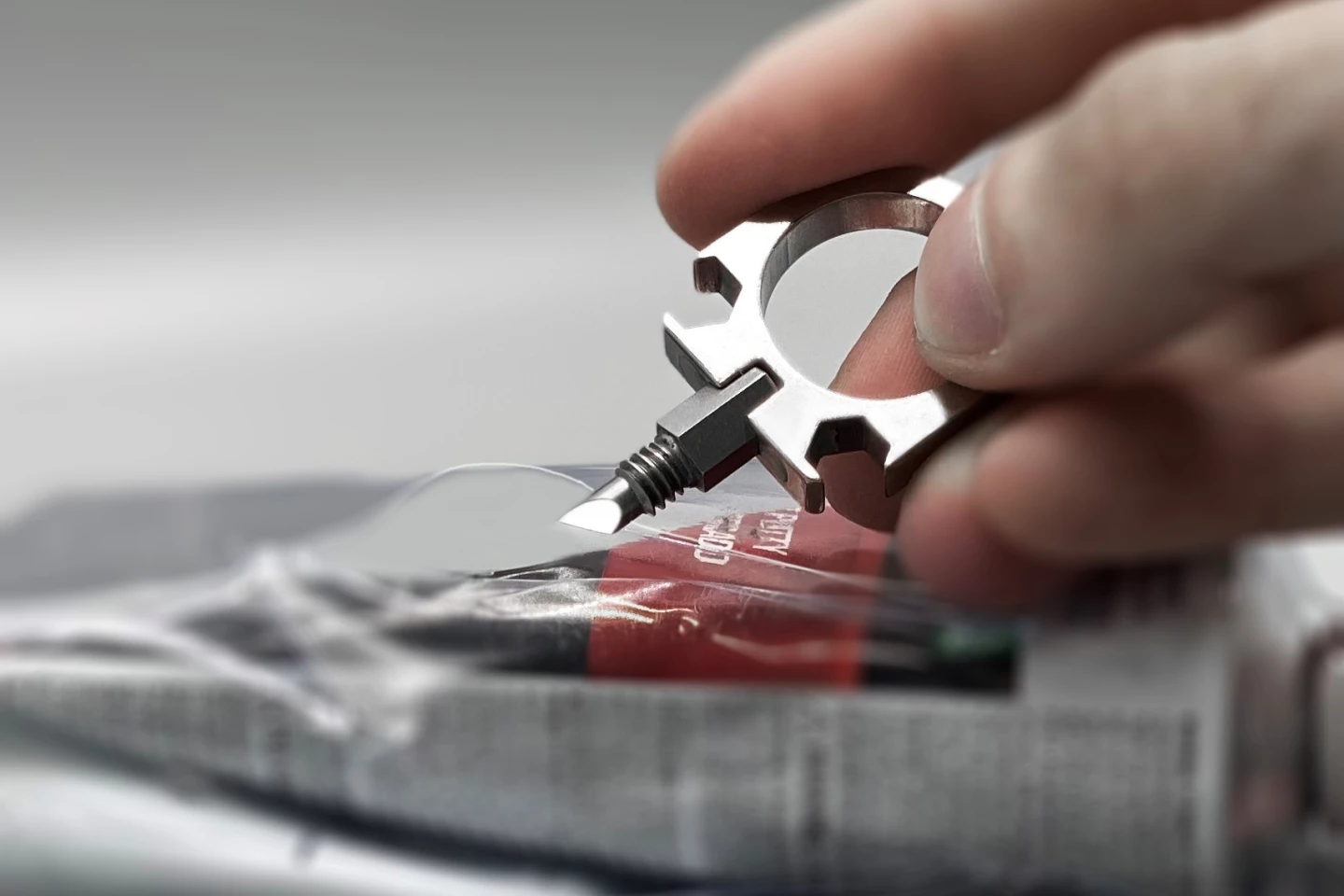 The Tool Ring features a blade attachment for everyday cutting tasks