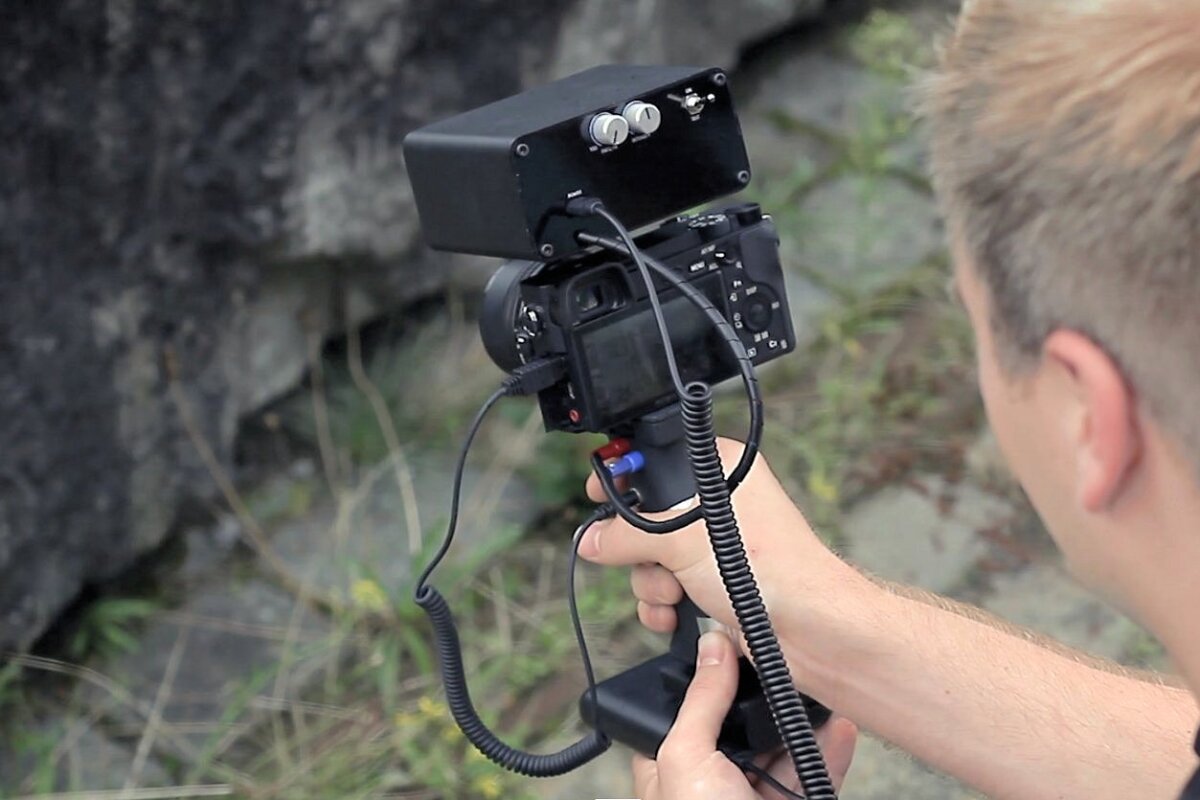 Camera attachment jolts a shutterbug into snapping "better" photos