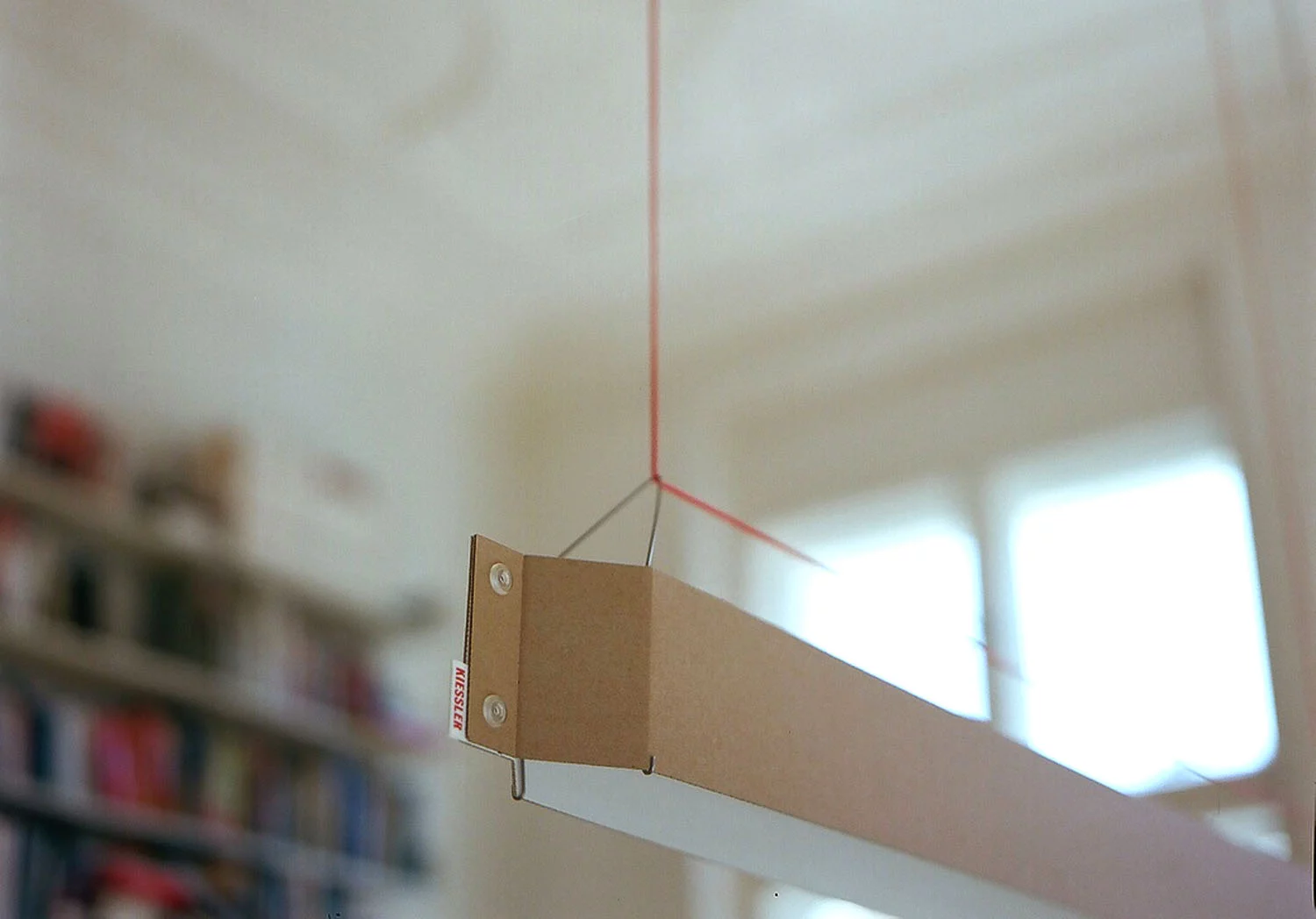 German designer Johannes Kiessler has created a sleek pendant lamp which is predominantly made from cardboard