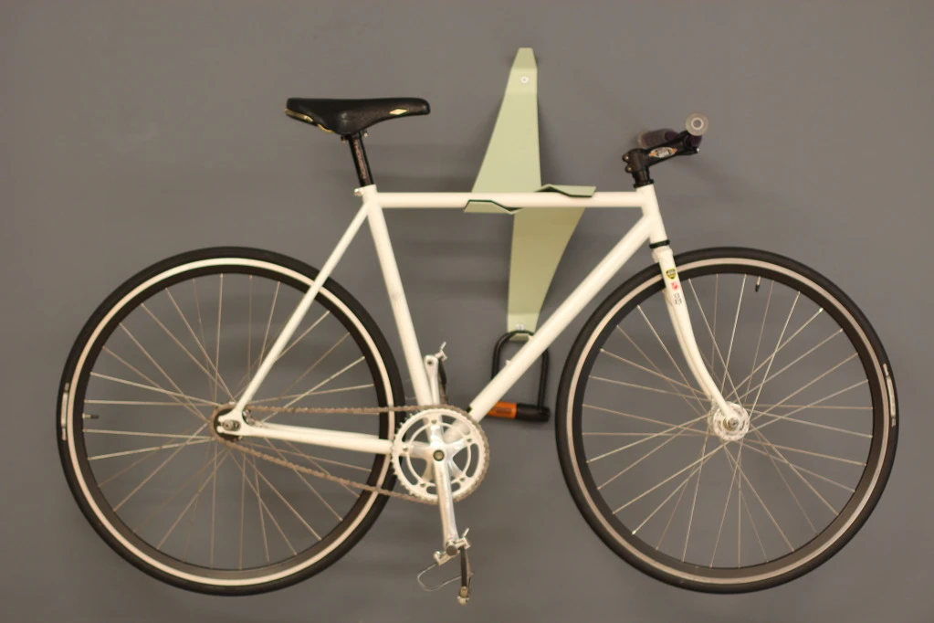 The Bike Valet is a bicycle wall storage device that uses a cantilevered design to hold bikes in place