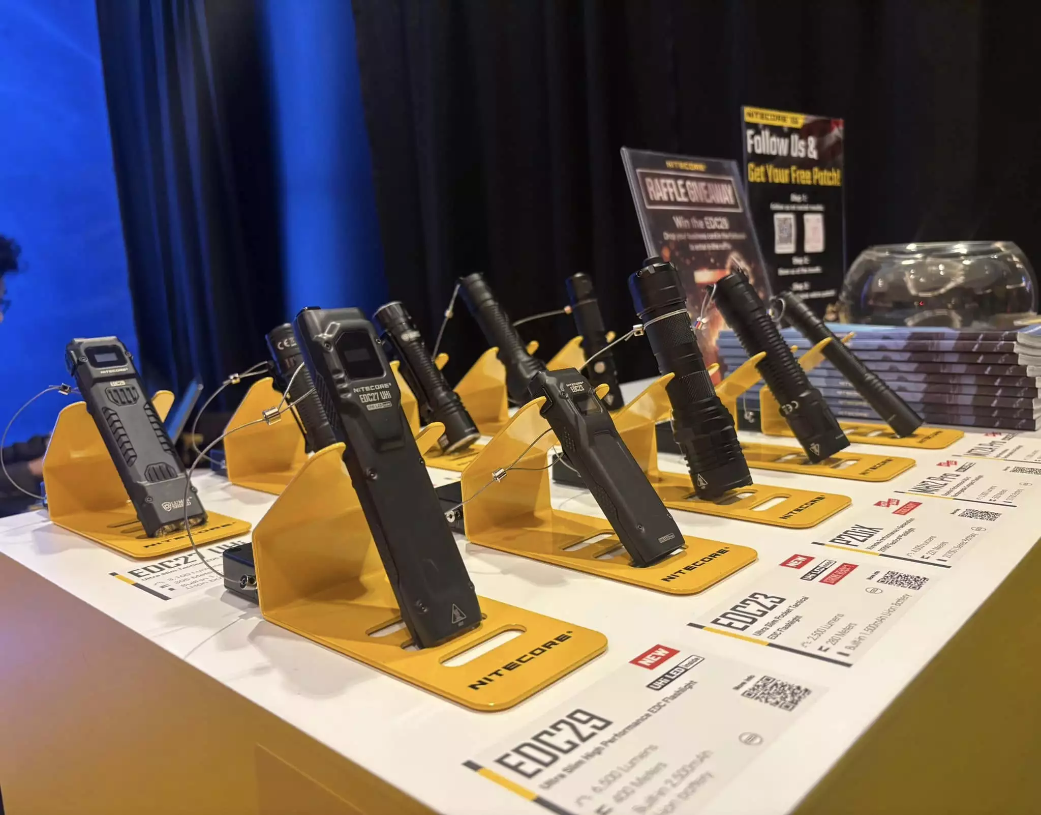 It looks like someone swapped the EDC27 Uhi and the EDC29 at Nitecore's 2024 SHOT Show booth, but both lights are accounted for