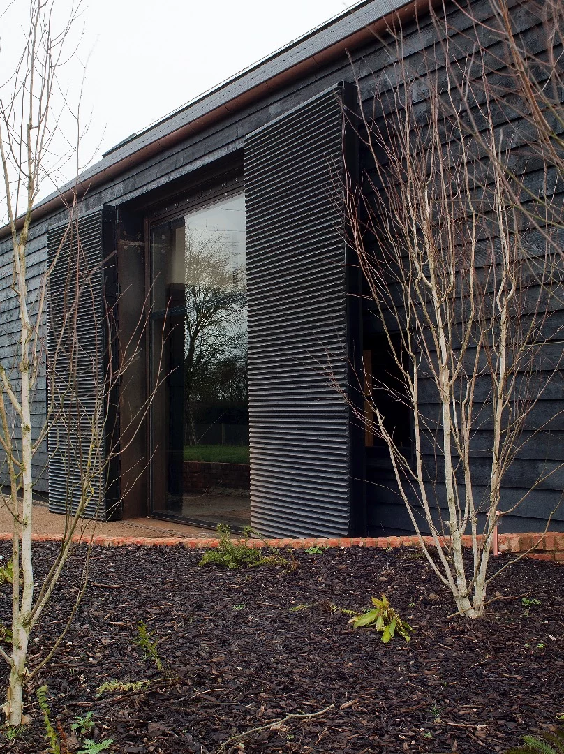 Liddicoat & Goldhill installed large insulated shutters which open to reveal a large glazed area