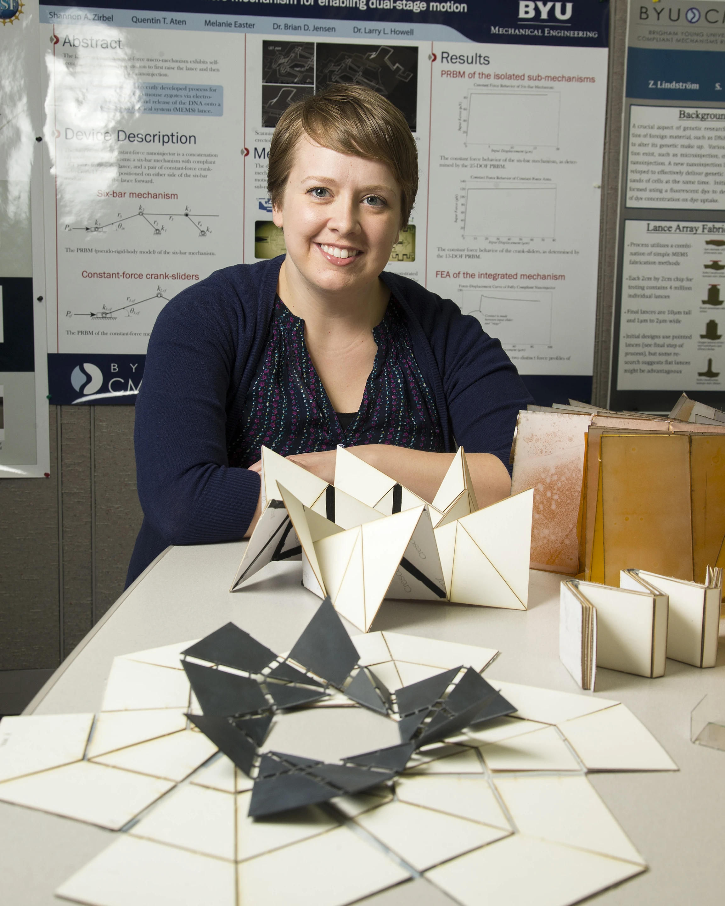 Shannon Zirbel with several iterations of the array (Photo: BYU)