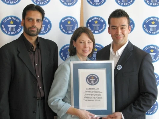 Irfan Khan and Kathleen Schaub receiving Guinness World Records certificate from judge Danny Girton