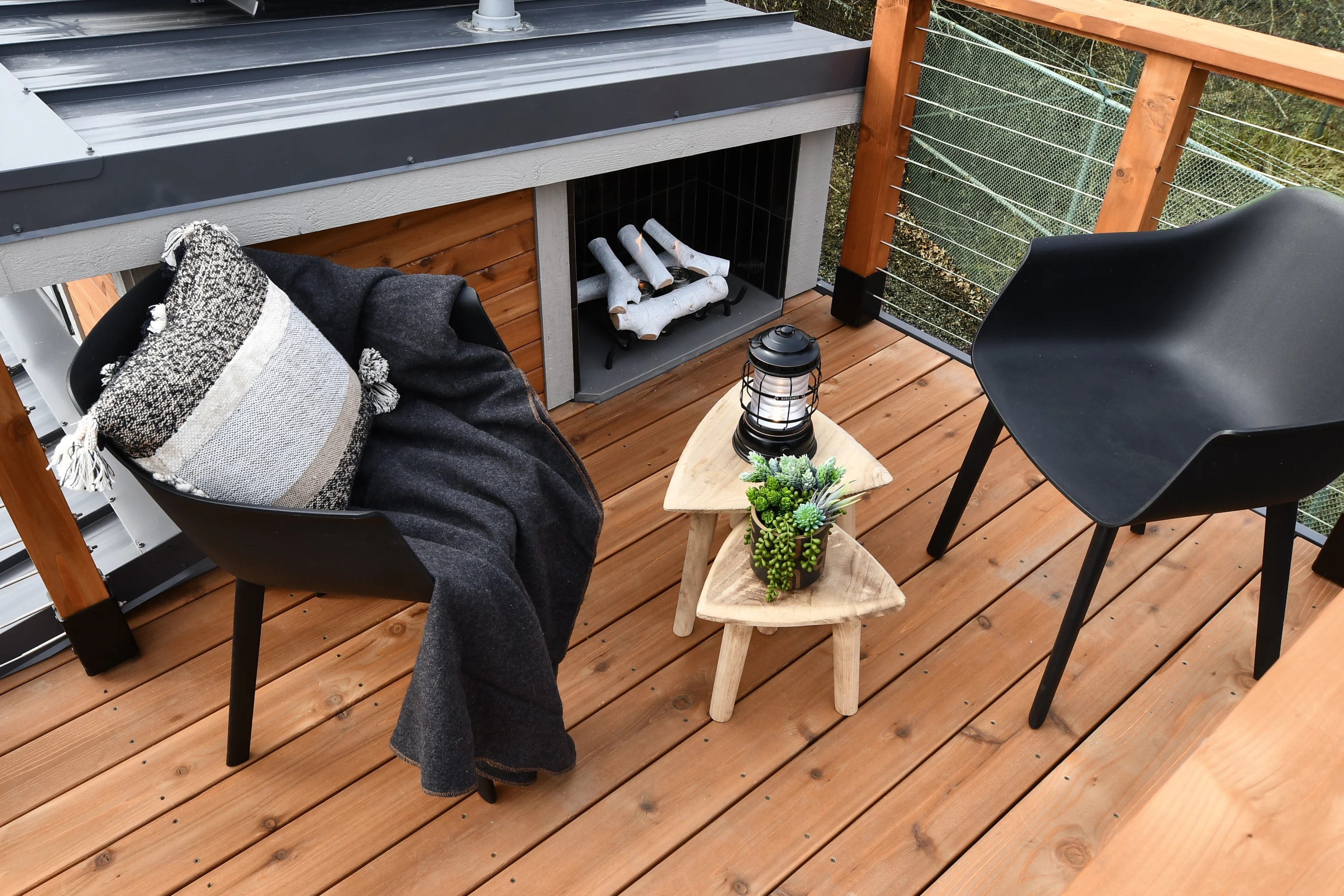 The Cascade Mini's rooftop terrace area includes some seating and another fireplace