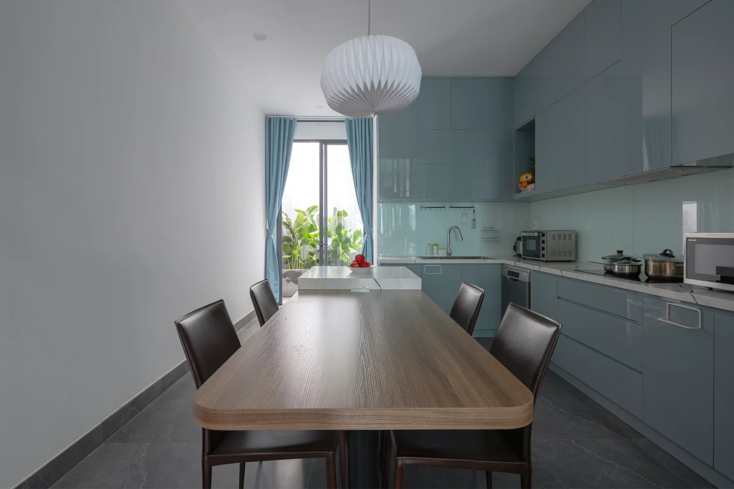 The Chic Vid House's kitchen opens up to the rear garden with double glass doors
