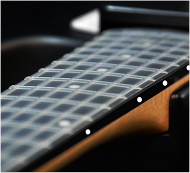 The uniform nylon strings of the Lineage MIDI Guitar prevent breakage and finger-tip abuse