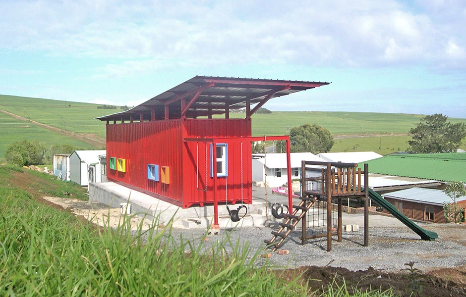 The most radical addition to the container is a horizontal solar shade - an expansive second roof above the container preventing solar radiation directly arriving at the classroom's outer surfaces thanks to the buffer of air between