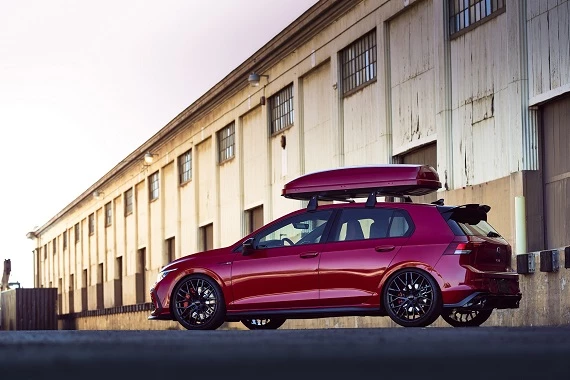 The VW Golf GTI Accessories Concept showcases a body-matching rooftop cargo container, roof rails, a new spoiler, and other Oettinger components