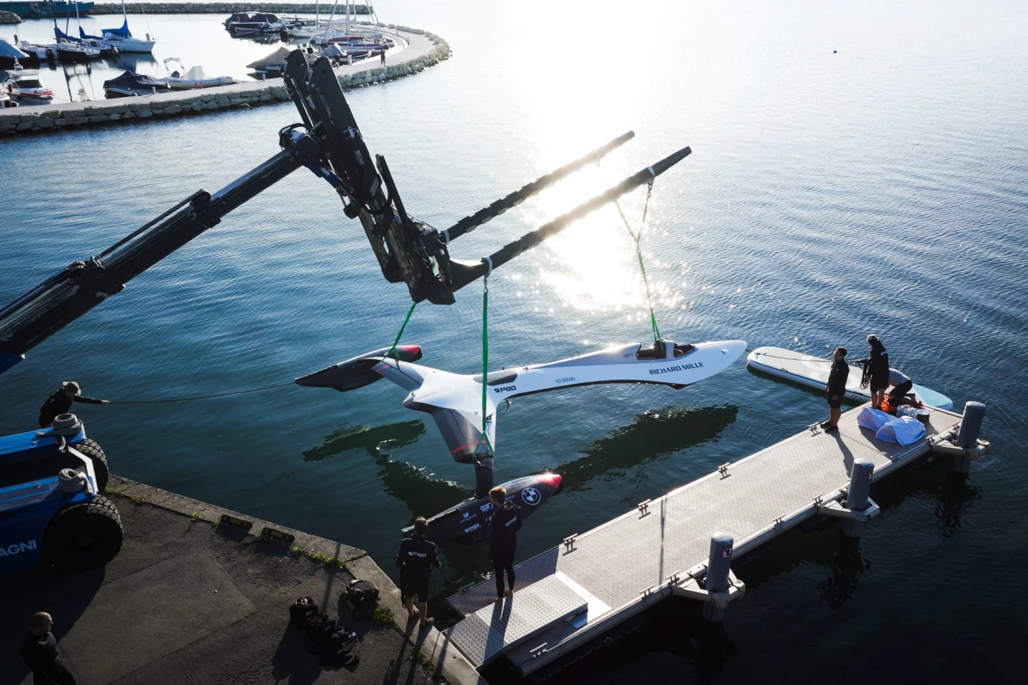 The SP80 is lowered into the smooth waters of Lake Geneva
