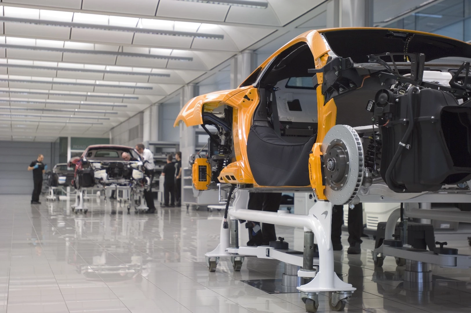 The floor of the McLaren Production Center is pristine, but busy