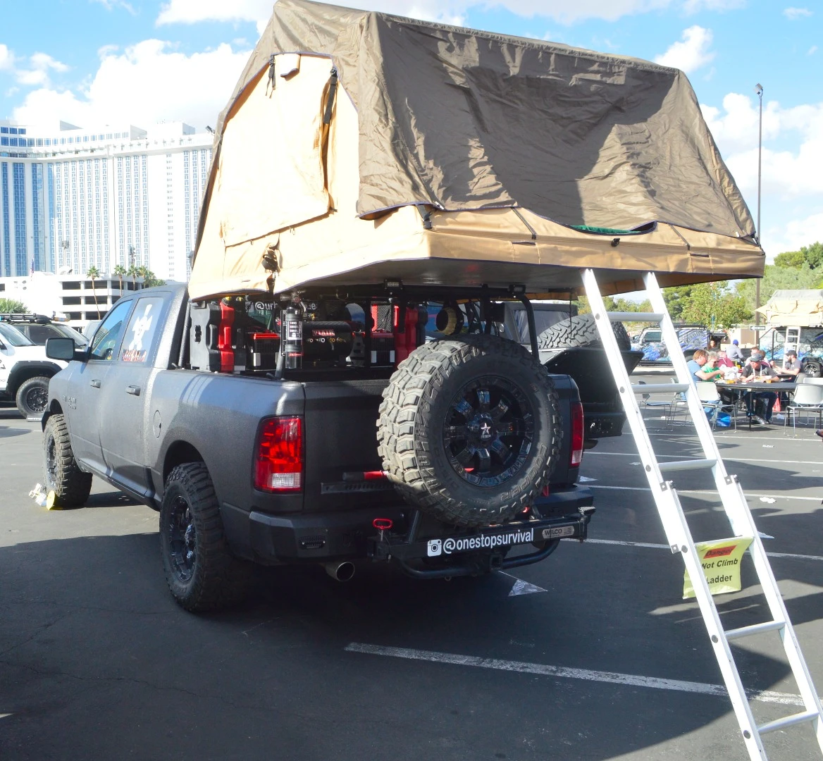 Ram 1500 pickup with bed rack-mounted roof-top tent