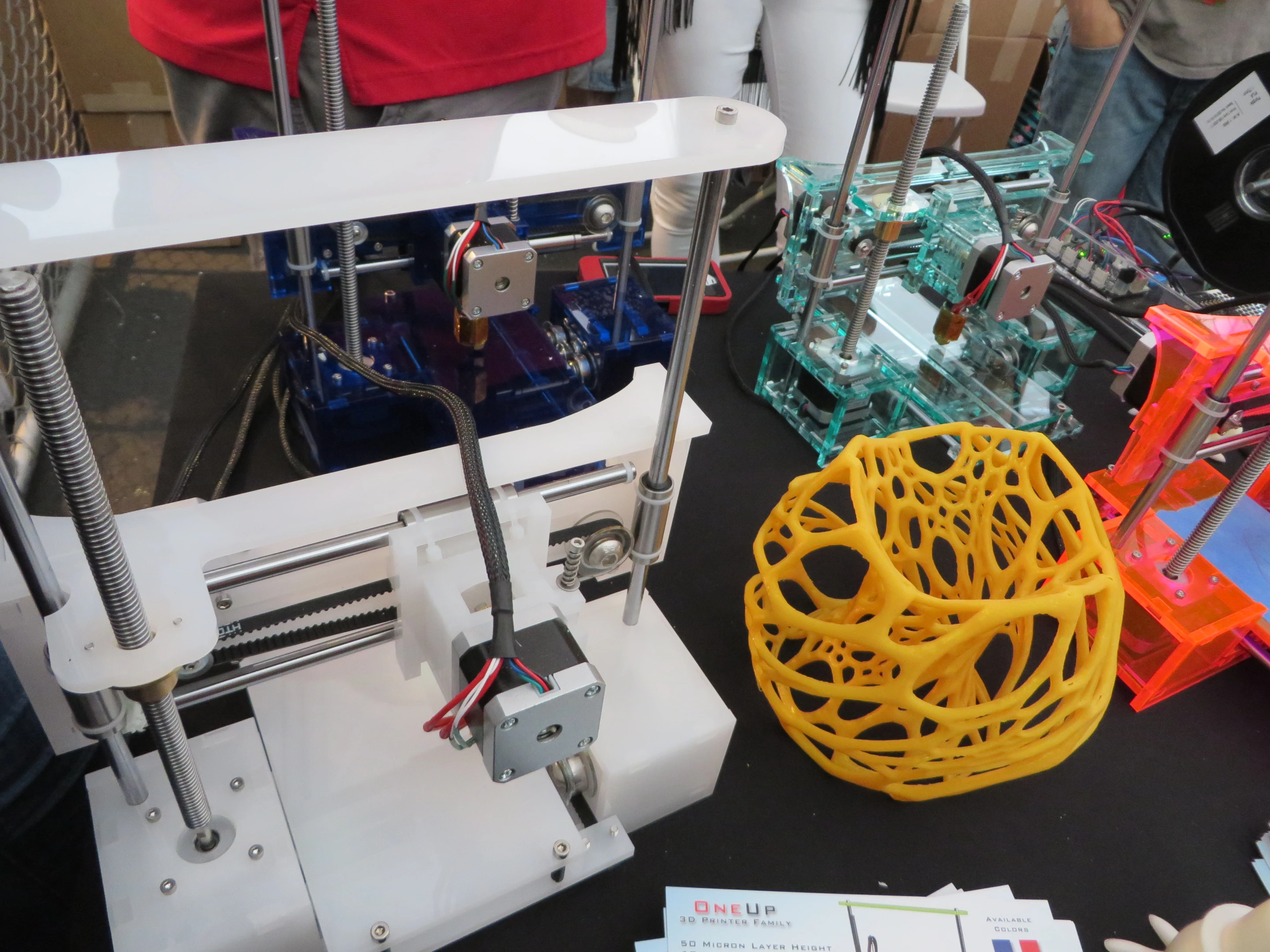 Assorted QU-BD printers on display at Maker Faire